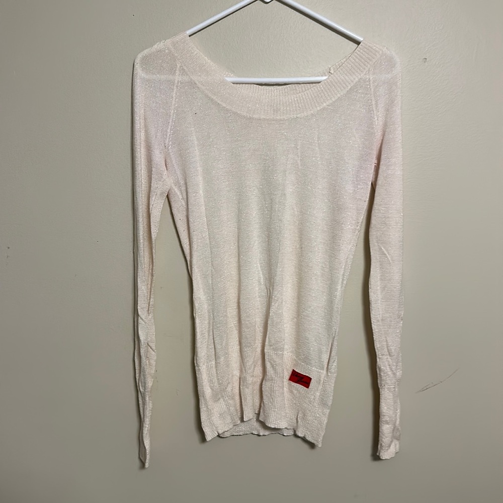 DKNY long sleeve open back shirt size medium.  Crème color